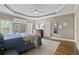 Relaxing bedroom with tray ceilings, hardwood floors, a ceiling fan, natural light, and neutral wall paint at 181 Pinehurst Ln, Marietta, GA 30068