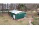 Shed in backyard of property for storage, featuring a metal roof and wide entry door at 181 Pinehurst Ln, Marietta, GA 30068