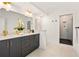 Modern bathroom with double vanity, gold fixtures, and a glass-enclosed shower at 1836 Memorial Dr # 303, Atlanta, GA 30317