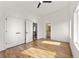 Bright bedroom with hardwood floors, ceiling fan, ensuite bathroom and walk-in closet at 1836 Memorial Dr # 303, Atlanta, GA 30317