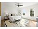 Bright bedroom with white walls, wood floors, ceiling fan and a modern, minimalist aesthetic at 1836 Memorial Dr # 303, Atlanta, GA 30317