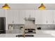 Modern kitchen featuring white cabinets, stainless steel appliances, and granite countertops at 1836 Memorial Dr # 303, Atlanta, GA 30317