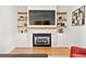 Cozy fireplace with marble surround and custom shelving in a modern living room at 1836 Memorial Dr # 303, Atlanta, GA 30317