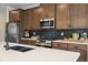 Beautiful kitchen with stainless steel appliances, dark backsplash, and a white countertop island at 114 Asher Dr, Carrollton, GA 30116