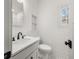 Bathroom boasts tile backsplash, hexagon tile floor, and a dark faucet at 1446 Metropolitan Se Ave, Atlanta, GA 30316