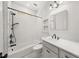 Bathroom boasts subway tile, white vanity and tub, and hexagon tile floors at 1446 Metropolitan Se Ave, Atlanta, GA 30316