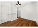 Bright bedroom showcasing hardwood floors, white walls, and a non-functional fireplace at 1446 Metropolitan Se Ave, Atlanta, GA 30316
