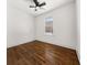 Bedroom boasts ceiling fan, hardwood floors, and window with natural light at 1446 Metropolitan Se Ave, Atlanta, GA 30316
