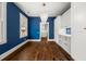 Elegant dining room with a modern chandelier and stylish blue walls at 1446 Metropolitan Se Ave, Atlanta, GA 30316