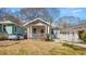 Charming craftsman home with a welcoming front porch and mature landscaping at 1446 Metropolitan Se Ave, Atlanta, GA 30316
