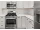 Modern kitchen features stainless steel appliances and white subway tile backsplash at 1446 Metropolitan Se Ave, Atlanta, GA 30316