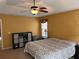 Bedroom showcasing a ceiling fan and a convenient cube storage unit at 180 Collins Way, Locust Grove, GA 30248