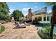Backyard with stone patio, fireplace, pool and outdoor lounge area at 2225 Johnson Ferry Rd., Marietta, GA 30062