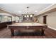 Basement with pool table, custom bar with stone accent and built-in wine rack at 2225 Johnson Ferry Rd., Marietta, GA 30062