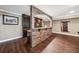 Basement bar area featuring a brick facade, wooden bar and plenty of space for entertaining at 2225 Johnson Ferry Rd., Marietta, GA 30062