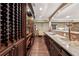 Finished basement bar area features custom cabinets and countertops with wine rack at 2225 Johnson Ferry Rd., Marietta, GA 30062