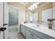 Bathroom with a white countertop, blue cabinets, and a shower-tub combination with tile surround at 2225 Johnson Ferry Rd., Marietta, GA 30062