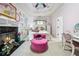 Pink bedroom with a fireplace, a plush round chair, a whimsical design, and a vanity at 2225 Johnson Ferry Rd., Marietta, GA 30062