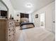 Bedroom with neutral walls, carpet, and a door leading to an ensuite bathroom at 2225 Johnson Ferry Rd., Marietta, GA 30062