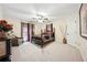 Bedroom with neutral carpet, ceiling fan, furnishings and window with decorative curtains at 2225 Johnson Ferry Rd., Marietta, GA 30062