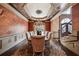 Formal dining room featuring hardwood floors, decorative walls, a chandelier, and a long dining table at 2225 Johnson Ferry Rd., Marietta, GA 30062