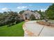 Elegant brick home with a circular driveway, fountain, and beautiful landscaping at 2225 Johnson Ferry Rd., Marietta, GA 30062
