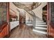 Elegant foyer features a curved staircase and detailed millwork at 2225 Johnson Ferry Rd., Marietta, GA 30062