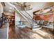Elegant foyer featuring a curved staircase, hardwood flooring, and a decorative water fountain feature at 2225 Johnson Ferry Rd., Marietta, GA 30062