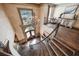 Overhead view of a grand foyer with a curved staircase, large window, and hardwood floors at 2225 Johnson Ferry Rd., Marietta, GA 30062