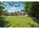 Expansive front yard features a putting green with a view of the home, circular drive and fountain at 2225 Johnson Ferry Rd., Marietta, GA 30062