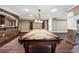 Game room with a pool table, bar, and wood floors, perfect for entertaining guests at 2225 Johnson Ferry Rd., Marietta, GA 30062