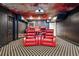 Home theater room with projector, tiered seating, carpeted floors and recessed lighting at 2225 Johnson Ferry Rd., Marietta, GA 30062