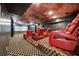 Home theater features tiered seating, projector, and a large screen for entertainment at 2225 Johnson Ferry Rd., Marietta, GA 30062