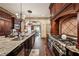 Elegant kitchen boasts granite counters, custom cabinetry, and a professional-grade range at 2225 Johnson Ferry Rd., Marietta, GA 30062