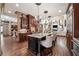 Open-concept kitchen with a spacious island, hardwood floors, and seamless access to living area at 2225 Johnson Ferry Rd., Marietta, GA 30062