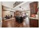 Spacious kitchen with dark wood cabinets, granite countertops, a central island, and stainless steel appliances at 2225 Johnson Ferry Rd., Marietta, GA 30062