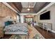 Beautiful main bedroom featuring a tray ceiling, elegant furnishings, and an ensuite bathroom at 2225 Johnson Ferry Rd., Marietta, GA 30062