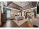 Luxurious main bedroom with a tray ceiling, hardwood floors, and a sitting area at 2225 Johnson Ferry Rd., Marietta, GA 30062