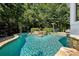 Backyard swimming pool with hot tub, stone accents and mature trees at 2225 Johnson Ferry Rd., Marietta, GA 30062