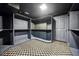 Basement storage room with custom shelving, carpeted floors and access door at 2225 Johnson Ferry Rd., Marietta, GA 30062