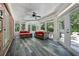 Bright sunroom with ceiling fan, wood ceiling, and several windows overlooking the yard at 2225 Johnson Ferry Rd., Marietta, GA 30062