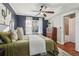 Comfortable bedroom featuring a ceiling fan, hardwood floors and neutral paint at 2230 Cheshire Bridge Ne Rd # 116, Atlanta, GA 30324