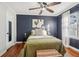 Cozy bedroom with a ceiling fan, hardwood floors and natural light from the window at 2230 Cheshire Bridge Ne Rd # 116, Atlanta, GA 30324