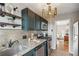 Updated kitchen features stainless appliances, granite counters and pendant lighting at 2230 Cheshire Bridge Ne Rd # 116, Atlanta, GA 30324