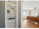 Living room features hardwood floors and custom shelving for storage or display at 2230 Cheshire Bridge Ne Rd # 116, Atlanta, GA 30324