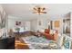 Open-concept living space with dining area, hardwood floors, leather couch, and a ceiling fan at 2230 Cheshire Bridge Ne Rd # 116, Atlanta, GA 30324