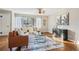 Bright living area with hardwood floors, a ceiling fan, and large windows at 2230 Cheshire Bridge Ne Rd # 116, Atlanta, GA 30324