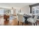Inviting living area featuring hardwood floors, a dining area, and a large window at 2230 Cheshire Bridge Ne Rd # 116, Atlanta, GA 30324