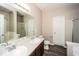 Bathroom with double vanity, large mirror, and separate shower and tub at 3641 Oakleaf Pass, Fairburn, GA 30213