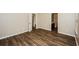 Bedroom featuring wood-look floors and an ensuite bathroom with great natural light at 3641 Oakleaf Pass, Fairburn, GA 30213